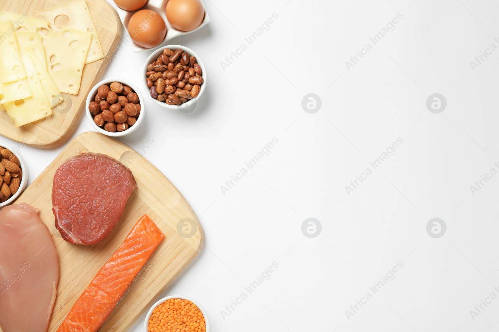 Photo of Different fresh products on white background, top view. Sources of essential amino acids