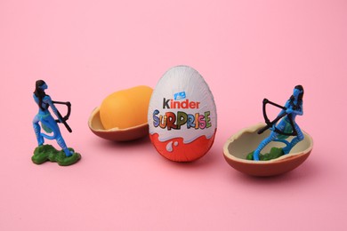 Sveti Vlas, Bulgaria - June 30, 2023: Kinder Surprise Eggs, plastic capsule and toys on pink background