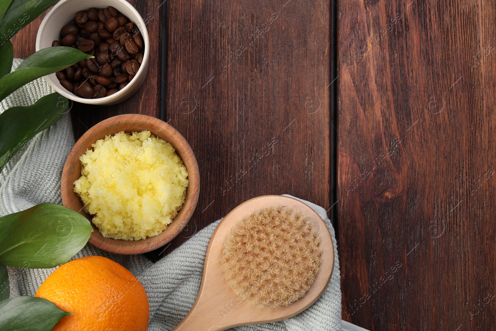 Photo of Flat lay composition with natural body scrub and fresh ingredients on wooden table, space for text. Anti cellulite treatment