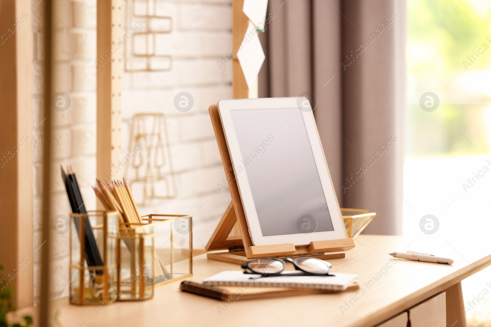 Photo of Gold accessories for interior design on table in room