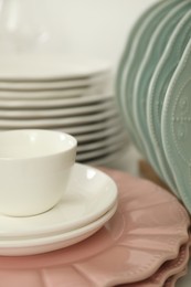 Photo of Clean plates and cup on table, closeup