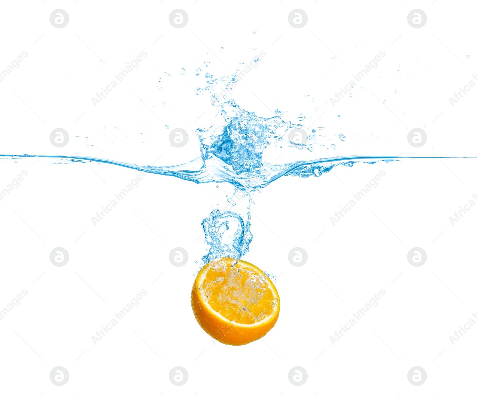 Photo of Ripe orange falling down into clear water with splashes against white background