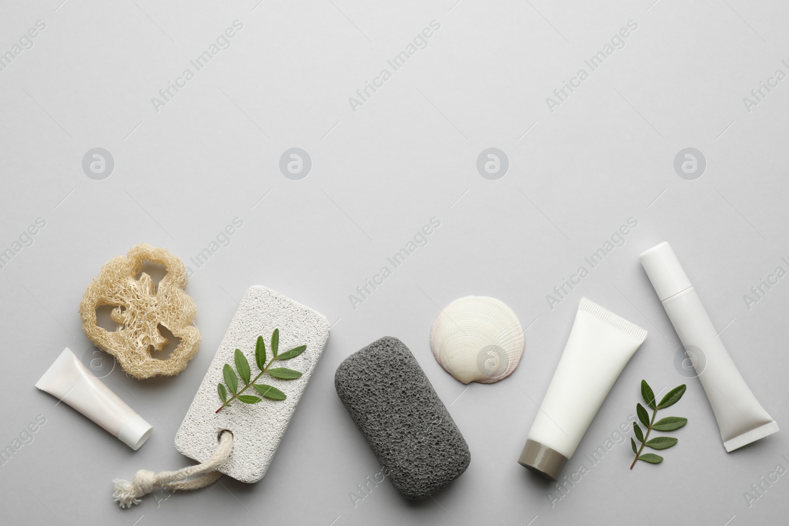 Photo of Flat lay composition with pumice stones on light grey background. Space for text