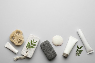 Flat lay composition with pumice stones on light grey background. Space for text