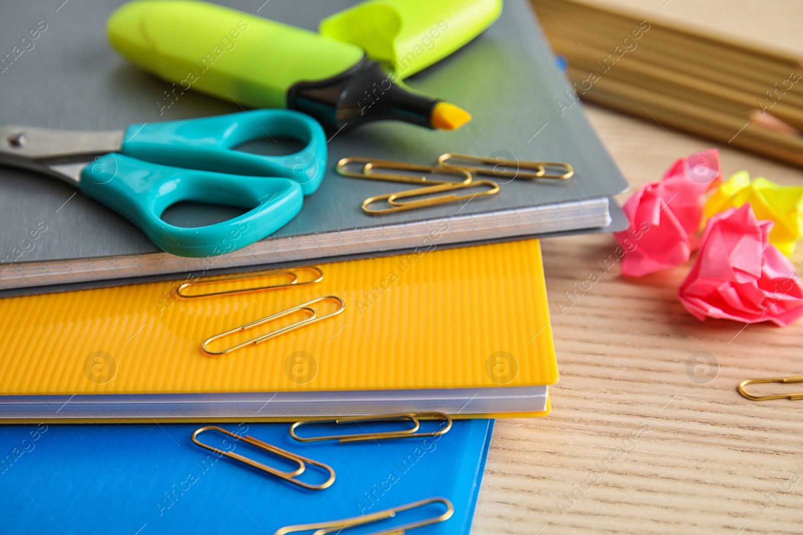 Photo of Different colorful stationery on wooden table. Back to school