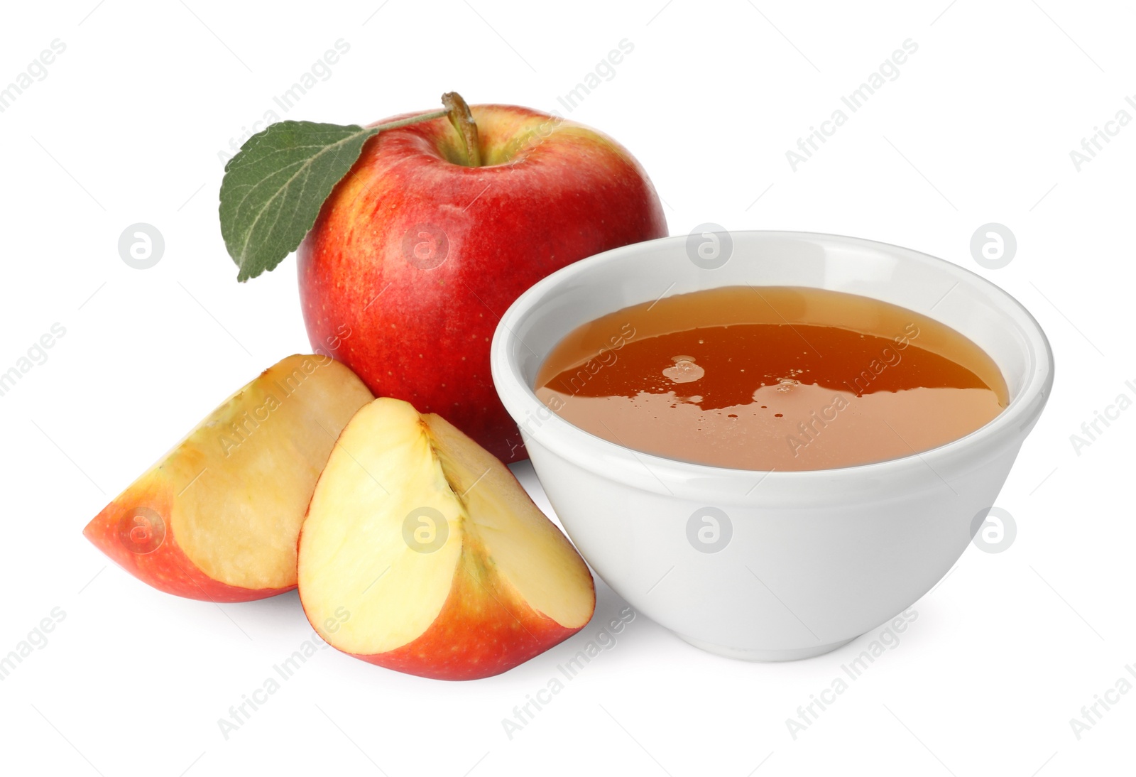 Photo of Delicious apples, leaves and bowl of honey isolated on white