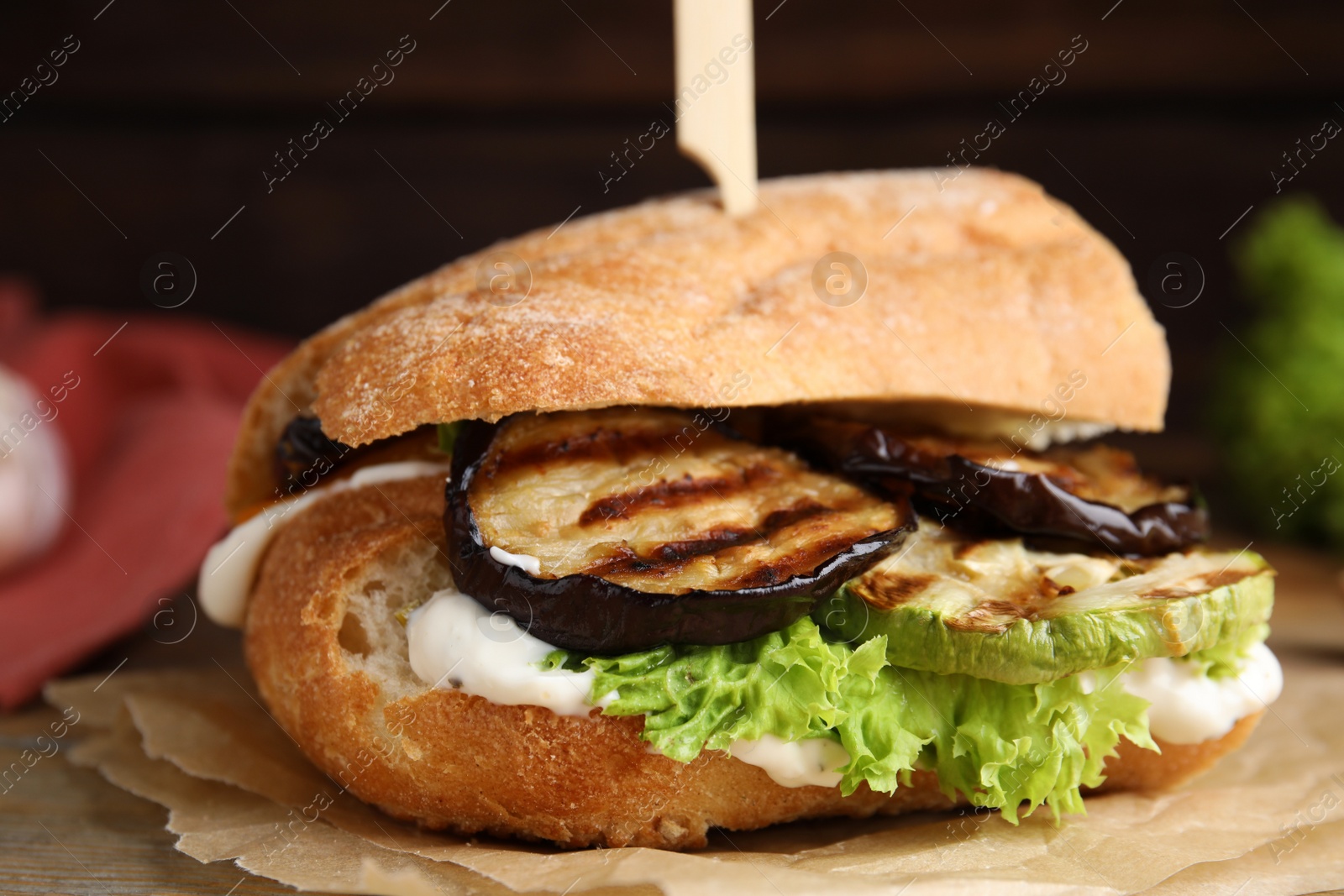 Photo of Delicious fresh eggplant sandwich served on table, closeup