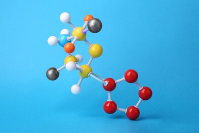 Structure of molecule on light blue background. Chemical model