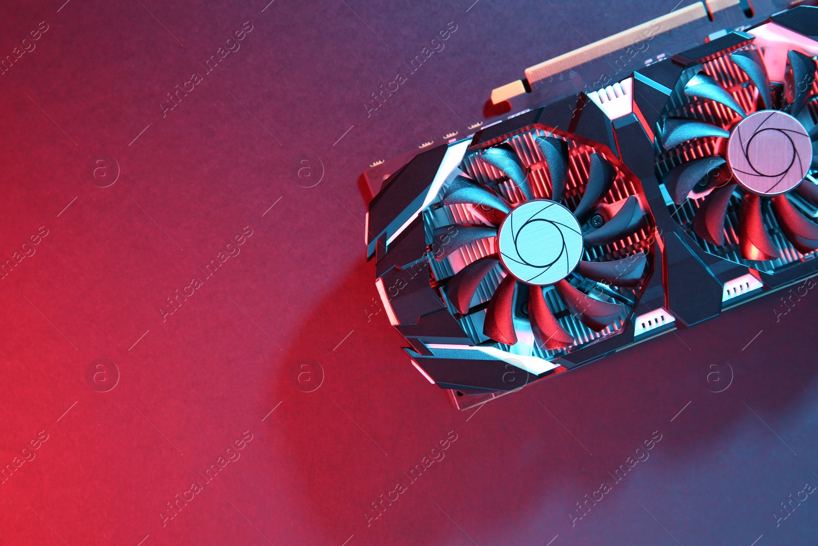 Photo of Computer graphics card on color background, top view. Space for text