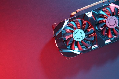 Photo of Computer graphics card on color background, top view. Space for text