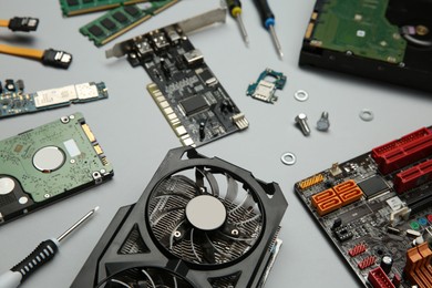 Photo of Graphics card and other computer hardware on light background, above view