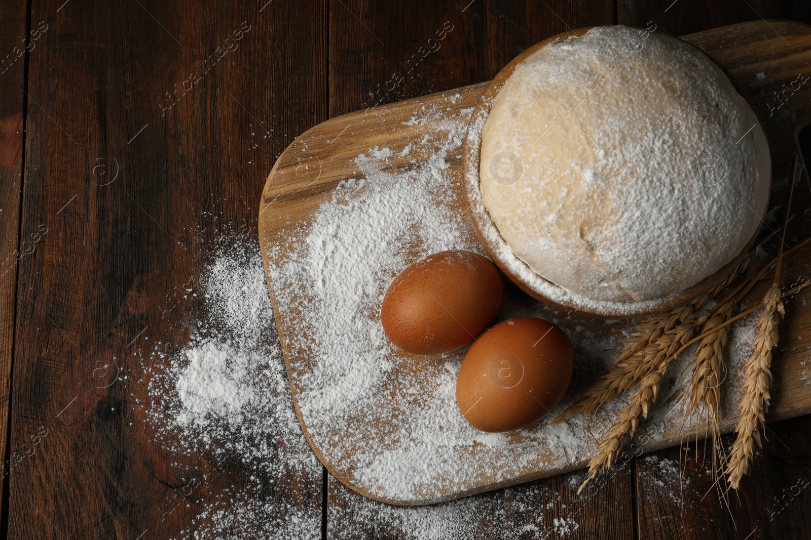 Photo of Flat lay composition with raw eggs and dough on wooden table. Baking pie