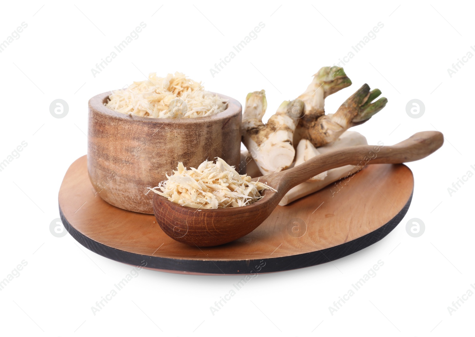 Photo of Board with grated horseradish, cut roots and spoon isolated on white