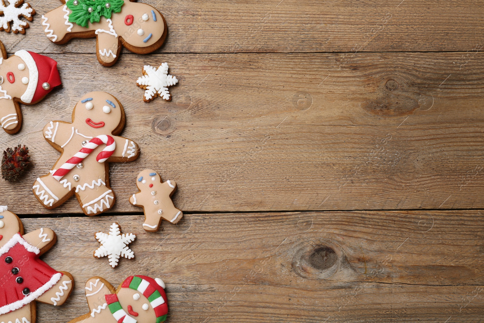 Photo of Delicious Christmas cookies on wooden table, flat lay. Space for text