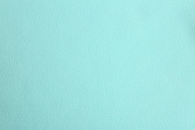 Photo of Texture of beautiful light blue fabric as background, closeup