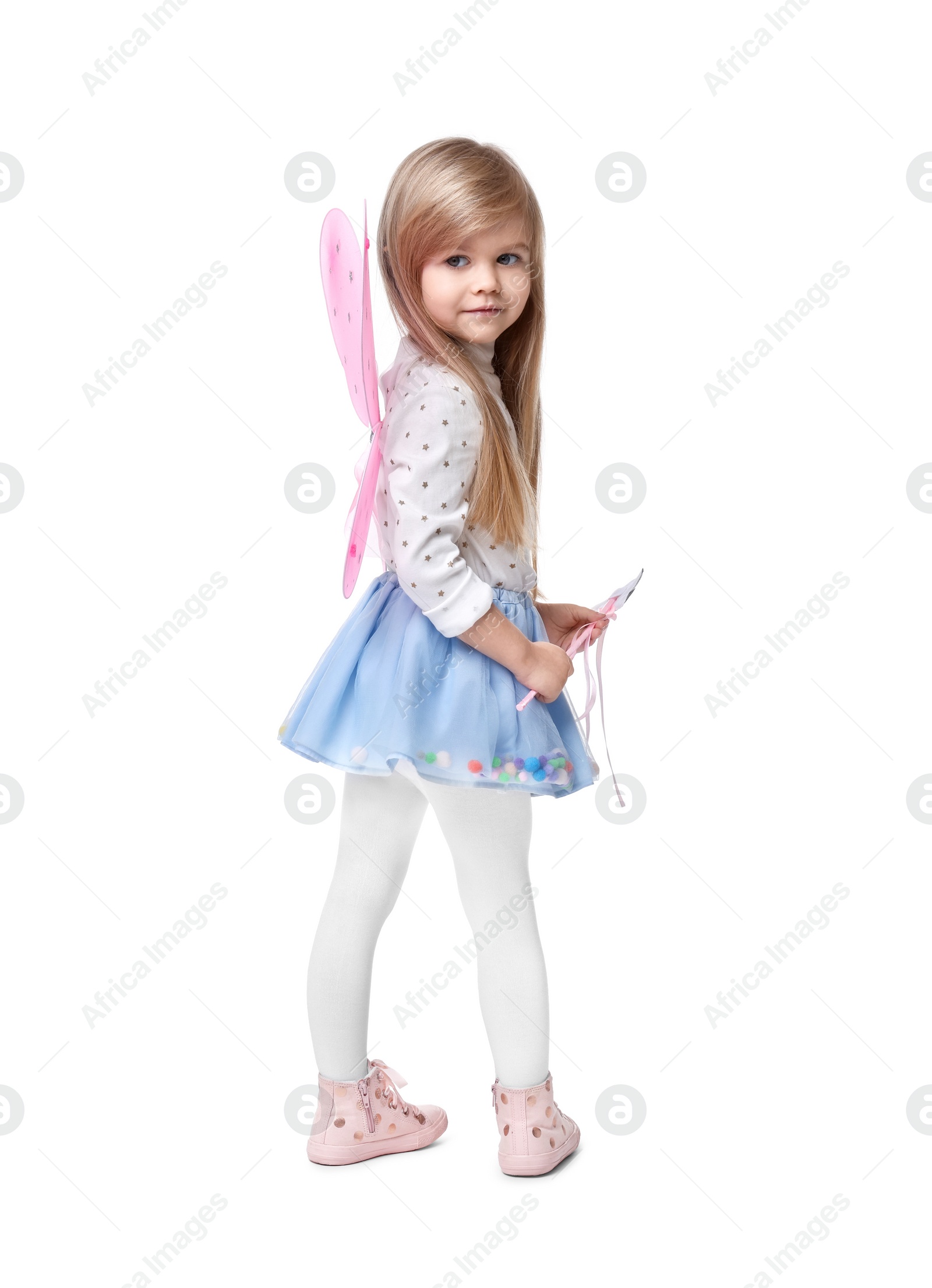 Photo of Cute little girl in fairy costume with pink wings and magic wand on white background