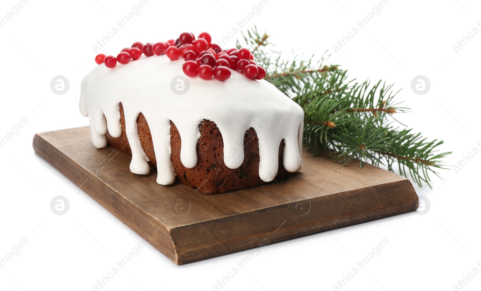 Photo of Traditional classic Christmas cake decorated with cranberries near fir tree branch isolated on white