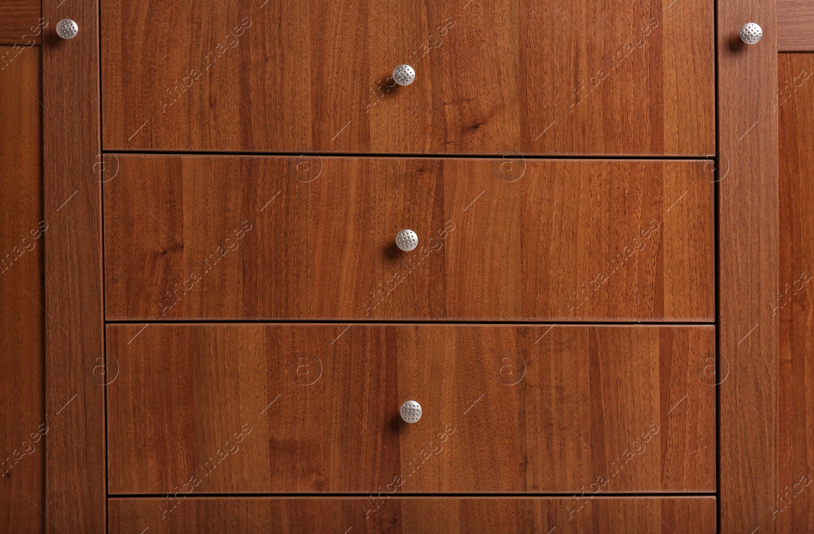 Photo of Wooden wardrobe drawers as background, closeup view