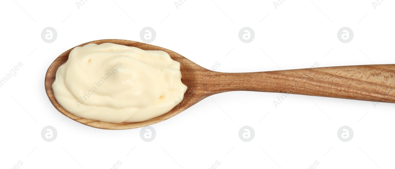 Photo of Fresh mayonnaise sauce in wooden spoon isolated on white, top view