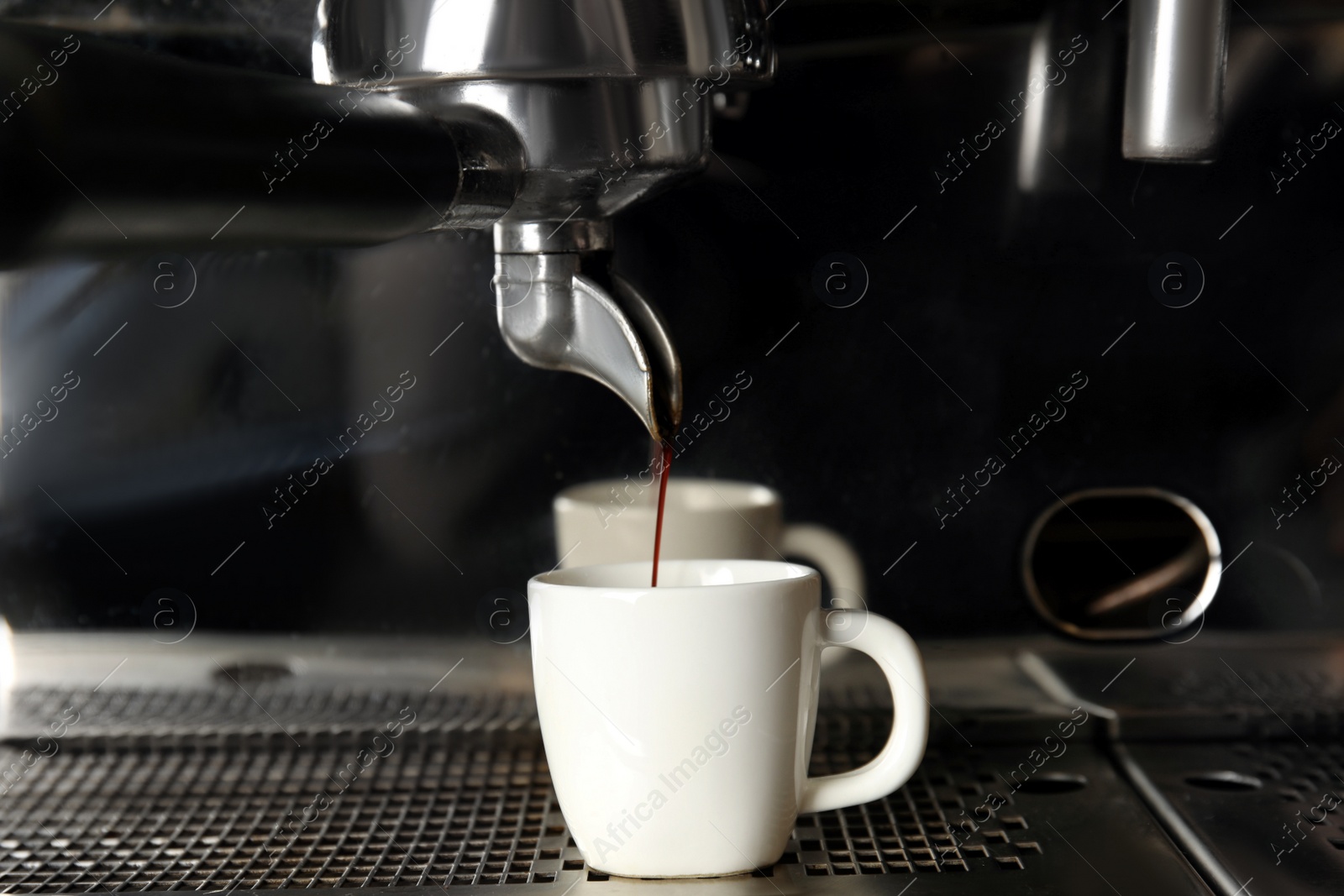 Photo of Making fresh aromatic espresso using professional coffee machine