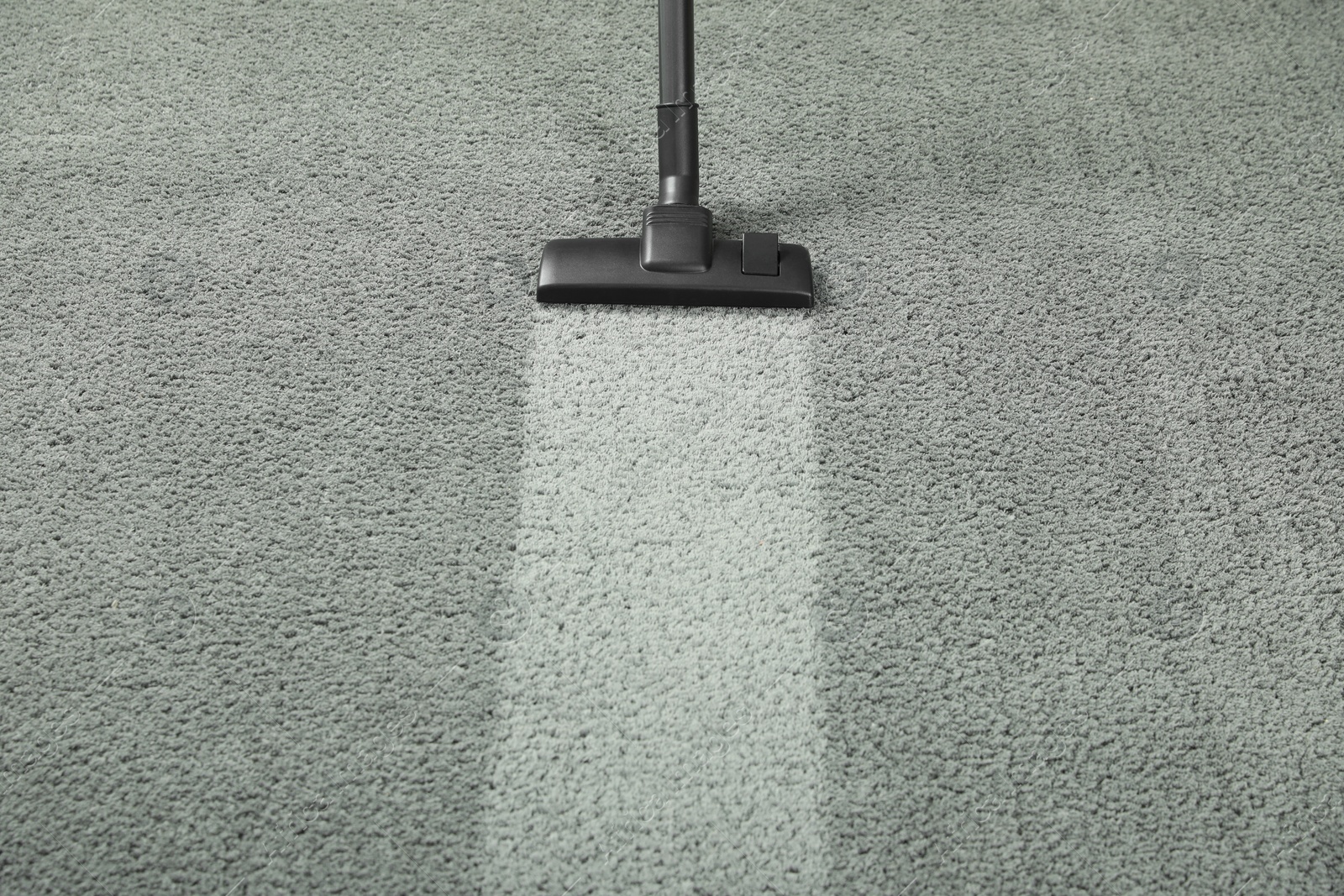 Photo of Vacuuming grey carpet. Clean area after using device. Space for text