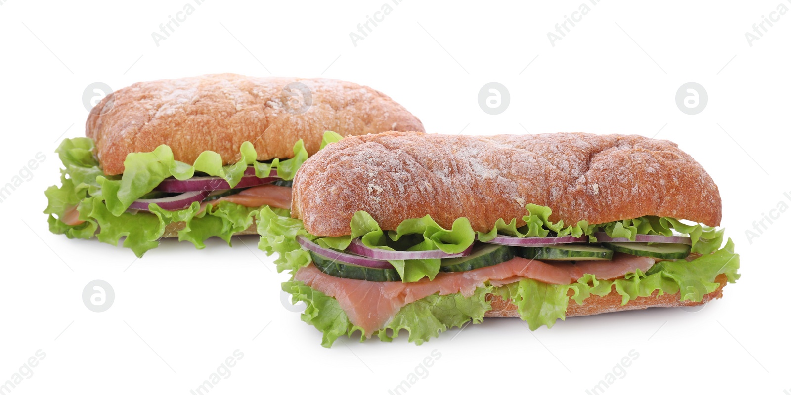 Photo of Delicious sandwiches with fresh vegetables and salmon isolated on white