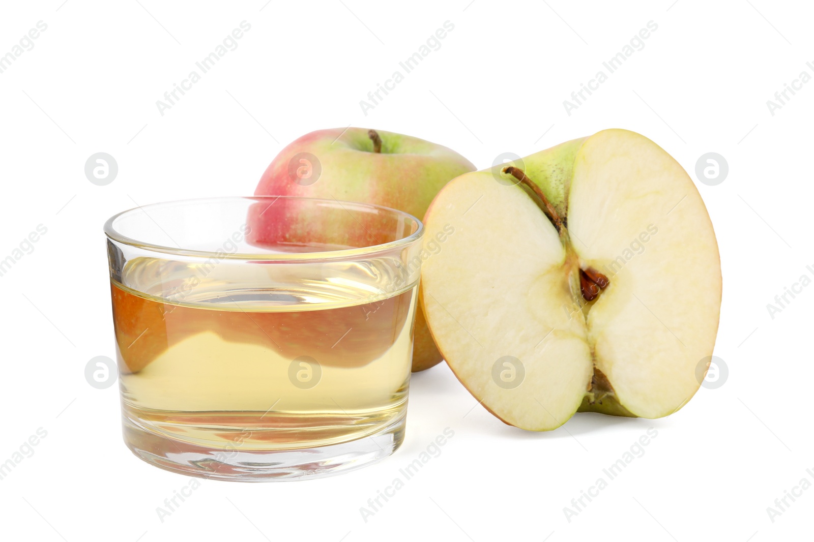 Photo of Apple vinegar in glass and fruits isolated on white