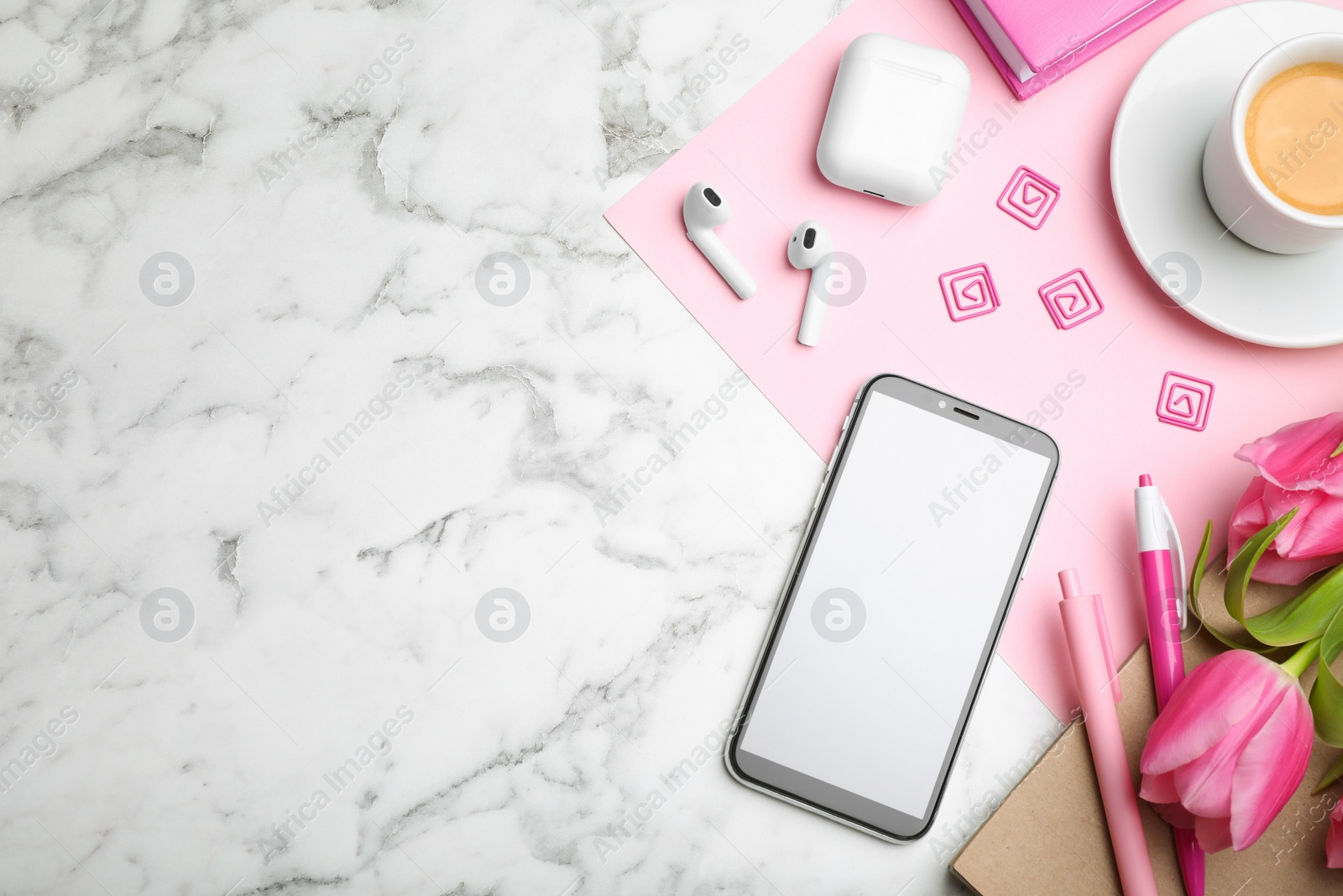 Photo of Flat lay composition with smartphone and cup of coffee on white marble table, space for text