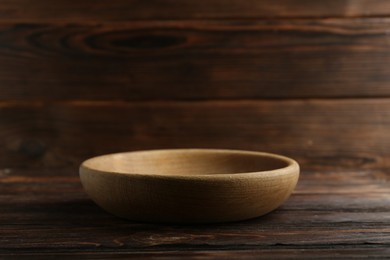 Beautiful bowl on wooden table, space for text