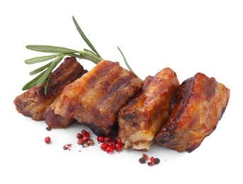 Photo of Tasty roasted pork ribs, rosemary and peppercorns isolated on white