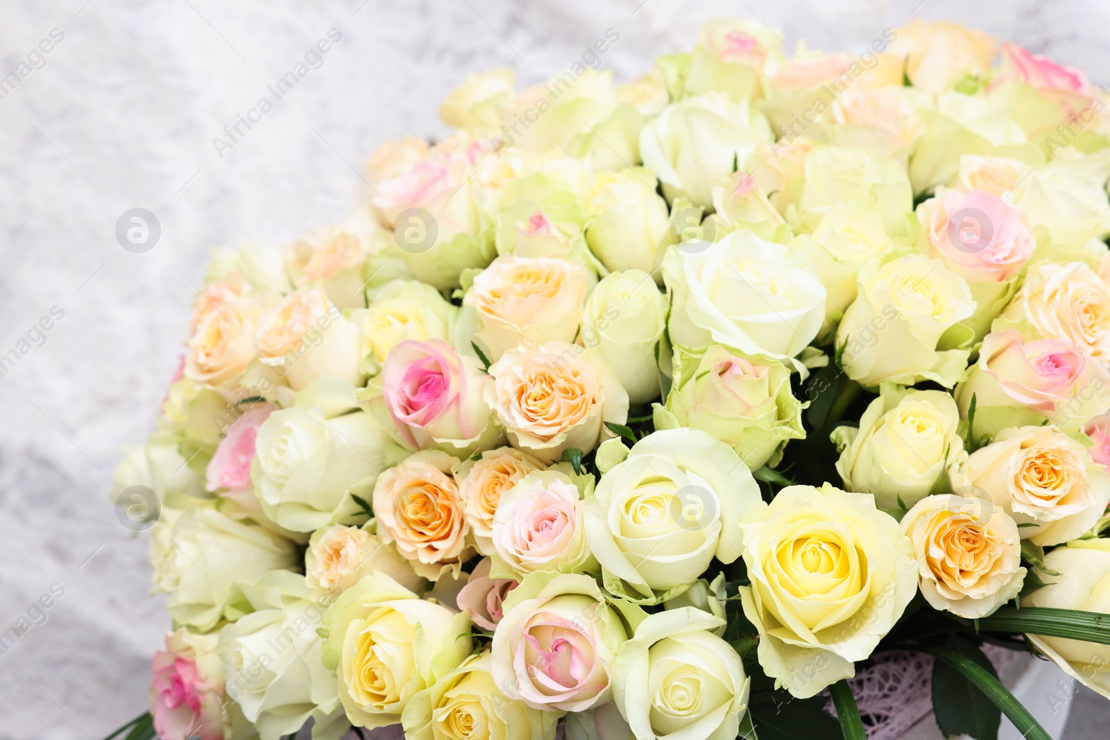 Photo of Bouquet of different beautiful roses, closeup view