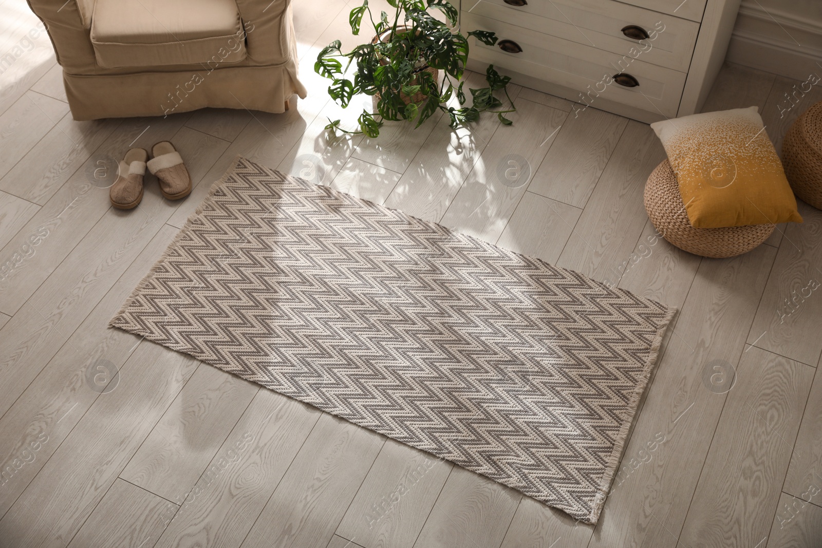 Photo of Modern room interior with stylish rug and furniture, above view