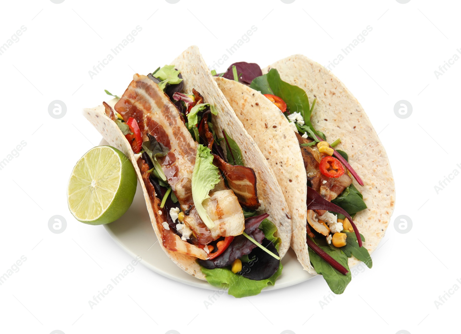Photo of Delicious tacos with fried bacon and lime on white background