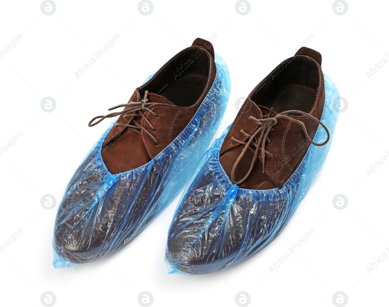 Photo of Pair of shoes in medical blue covers on white background
