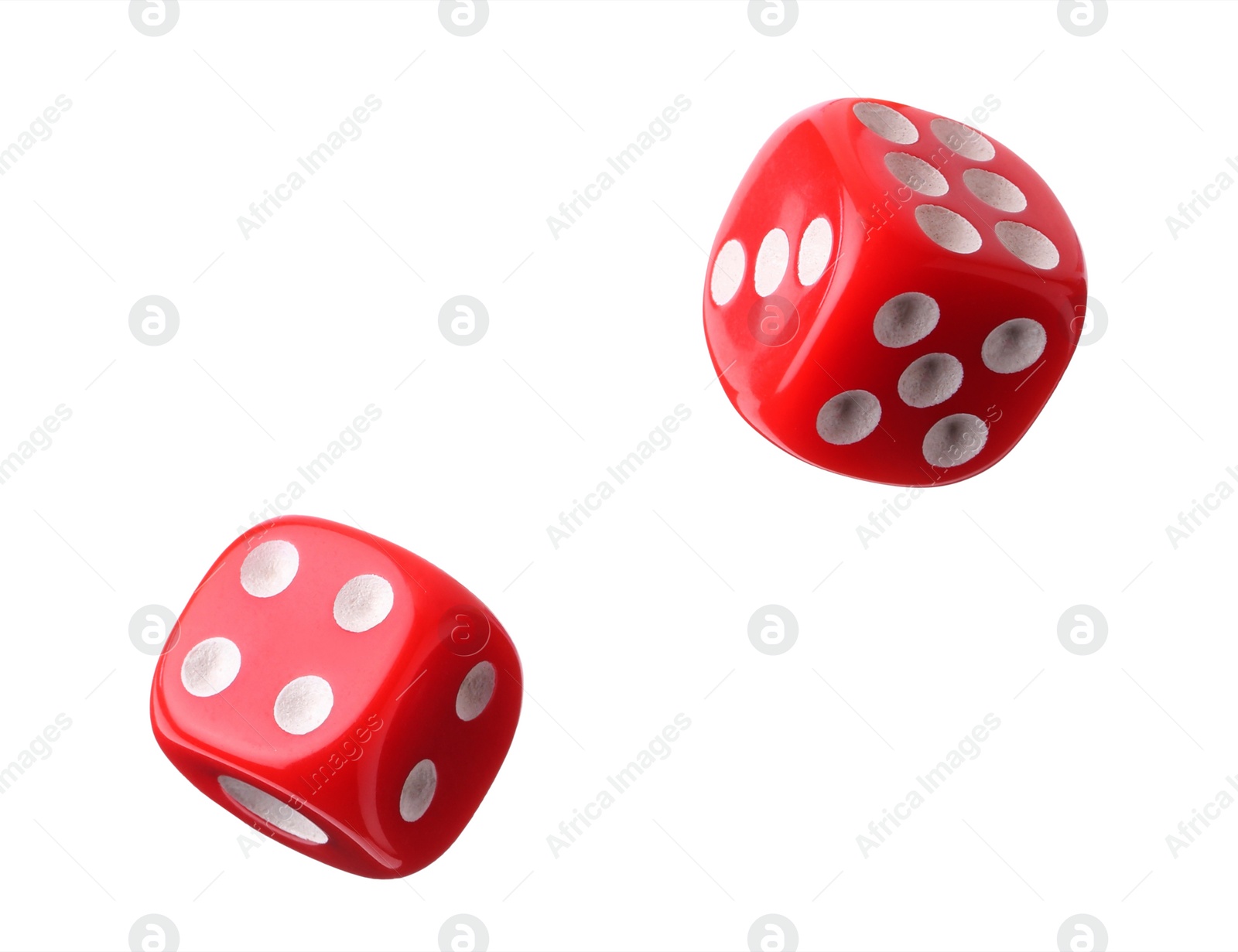 Image of Two red dice in air on white background