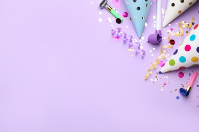 Photo of Beautiful flat lay composition with festive items on violet background, space for text. Surprise party concept