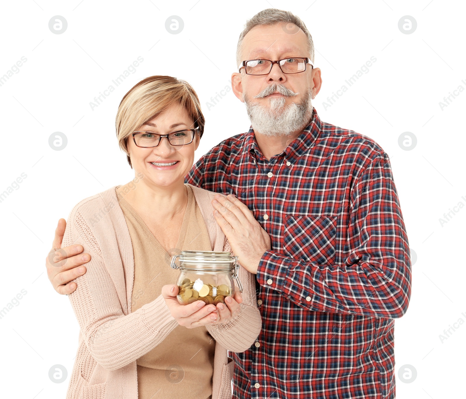 Photo of Happy senior man and his wife holding jar with coins on white background