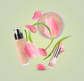 Spring flowers and makeup products in air on light green background