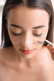 Photo of Attractive young woman with false eyelashes, closeup