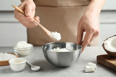 Photo of Woman preparing natural body scrub