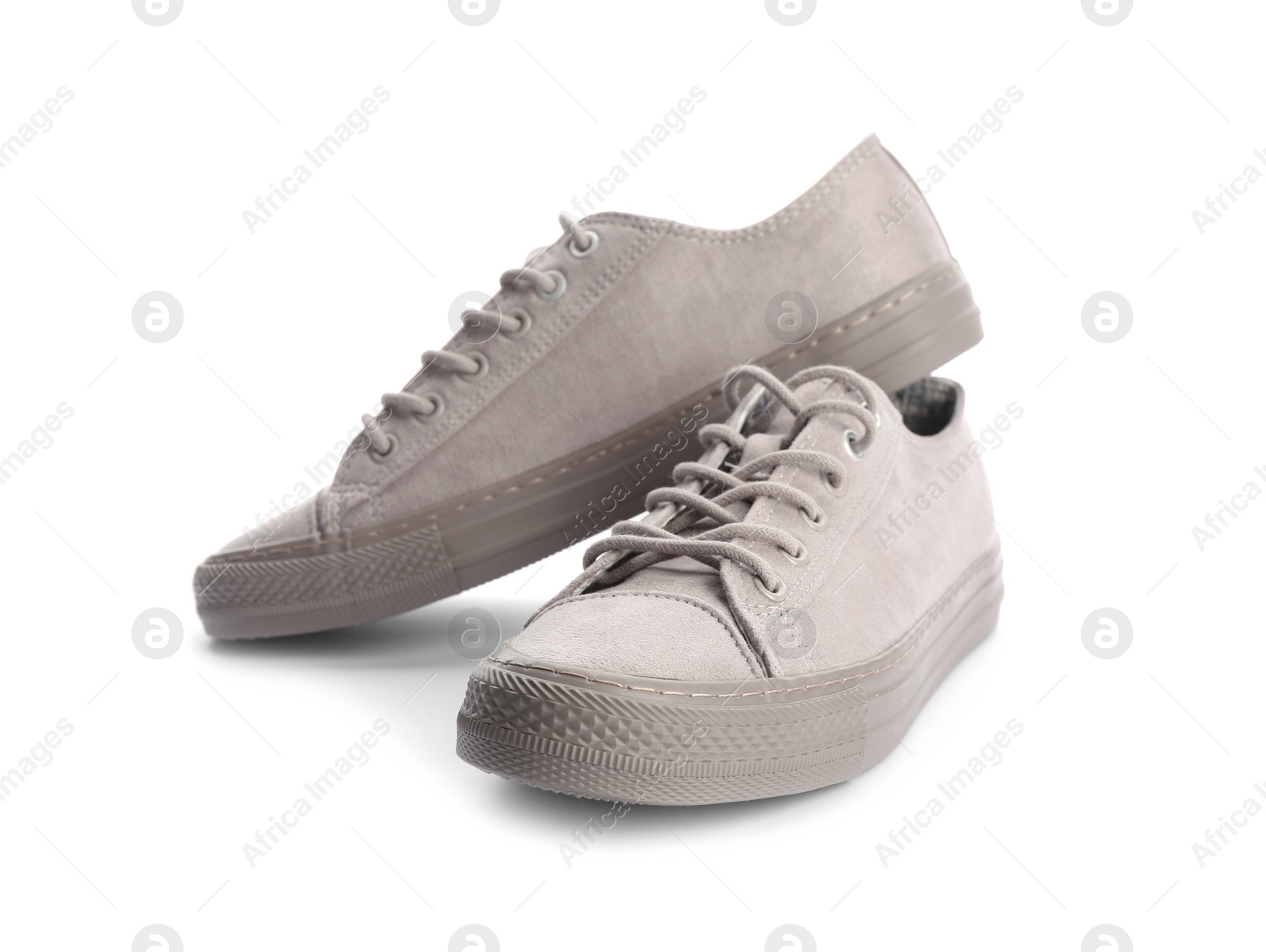 Photo of Pair of stylish sneakers on white background