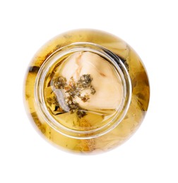 Photo of Open jar of delicious artichokes pickled in olive oil isolated on white, top view