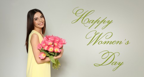 Image of Happy Women's Day, Charming lady holding bouquet of beautiful flowers on grey background