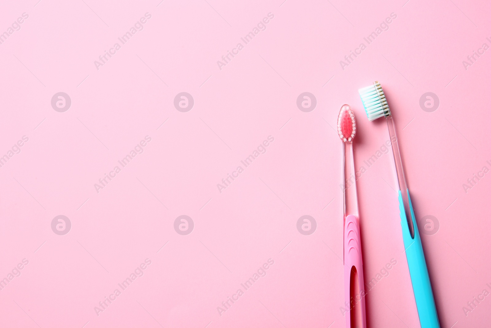 Photo of Manual toothbrushes on color background. Dental care