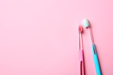 Photo of Manual toothbrushes on color background. Dental care