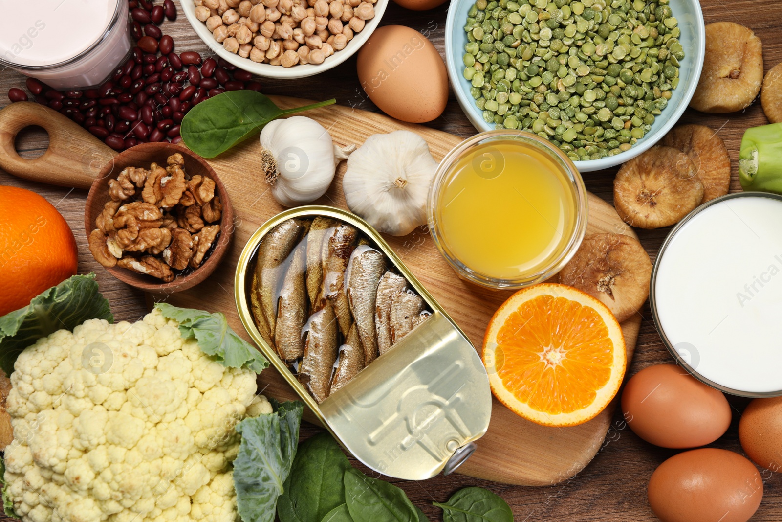 Photo of Set of natural food on wooden table, flat lay