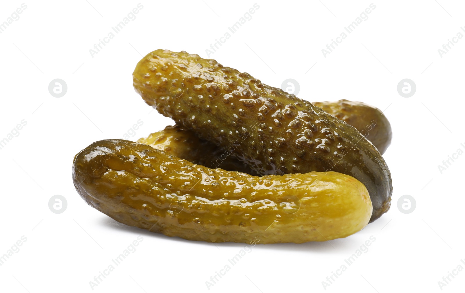 Photo of Pile of tasty pickled cucumbers isolated on white