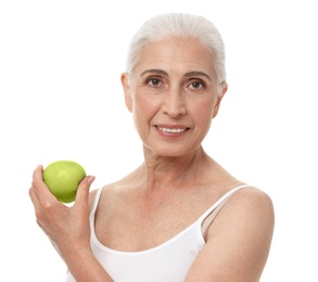 Photo of Portrait of beautiful mature woman with apple on white background