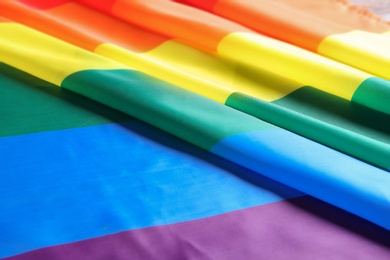 Photo of Bright rainbow gay flag as background. LGBT community