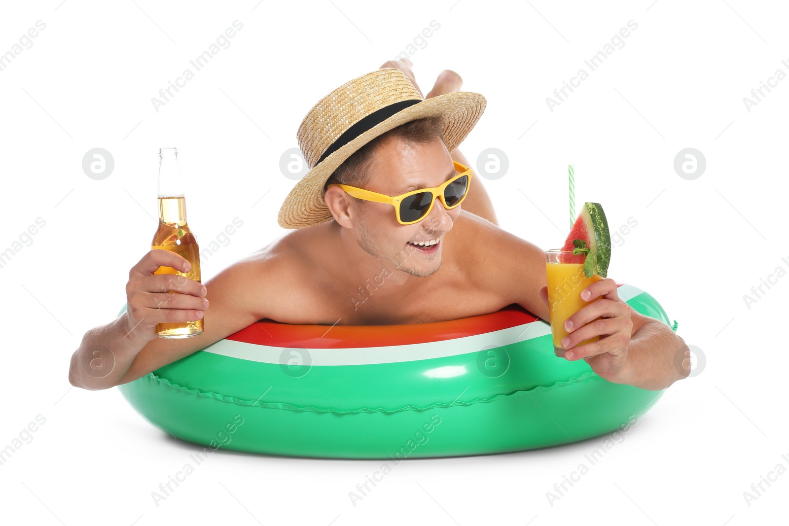 Photo of Shirtless man with inflatable ring,  cocktail and bottle of drink on white background